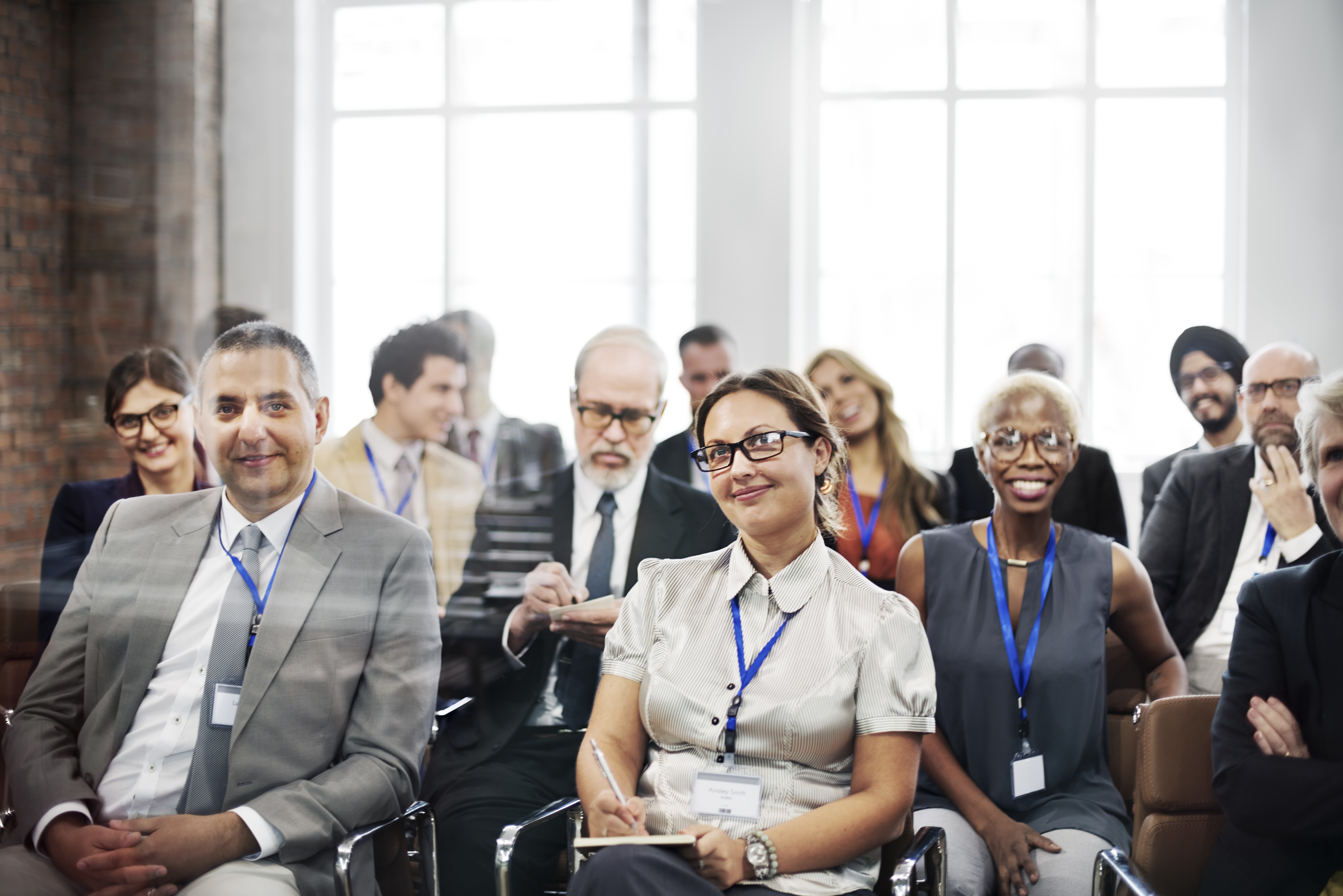 Group of professionals seated in a conference setting